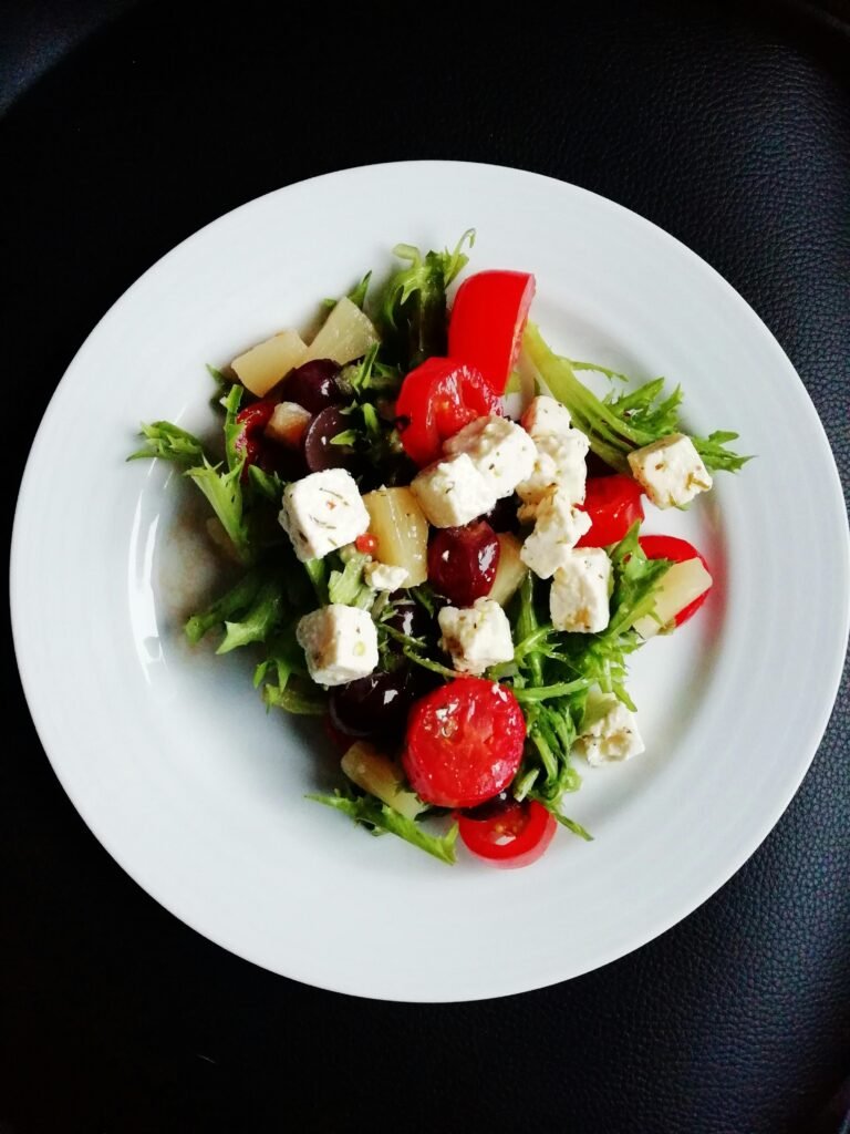 Delicious Greek salad featuring fresh vegetables and creamy feta cheese, perfect for a healthy meal.